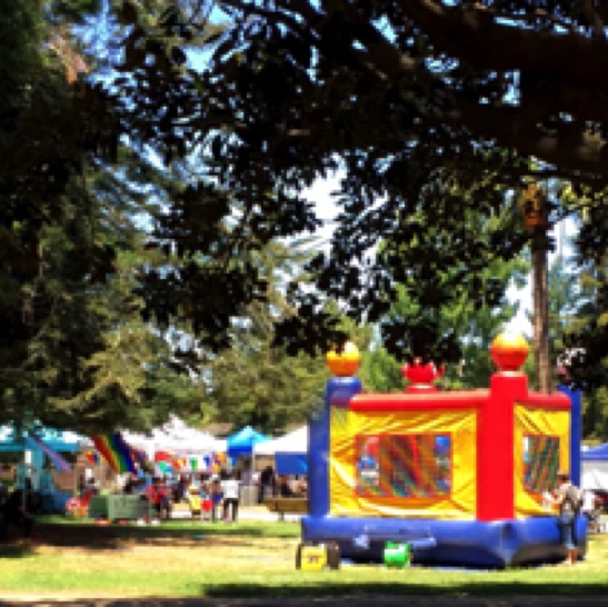 Taking the long, wide view: a bouncy castle, and dozens of colorful canopies